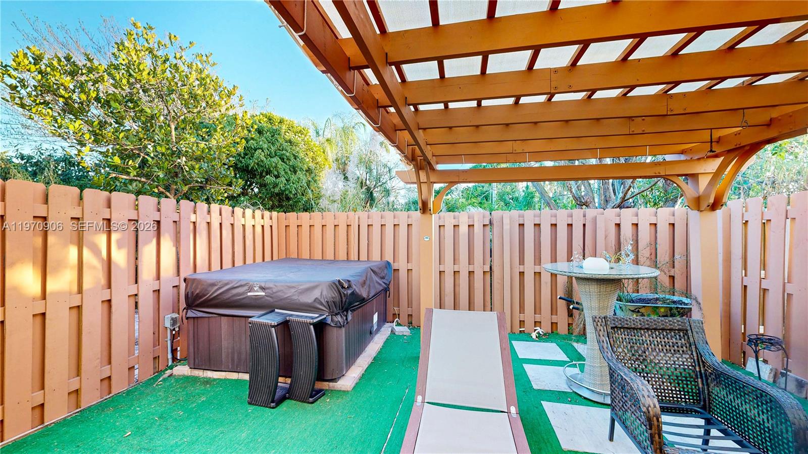 13158 Southwest 233rd Street Homestead, FL 33032 - Photo 44 of 72 a view of outdoor space with chairs and wooden fence