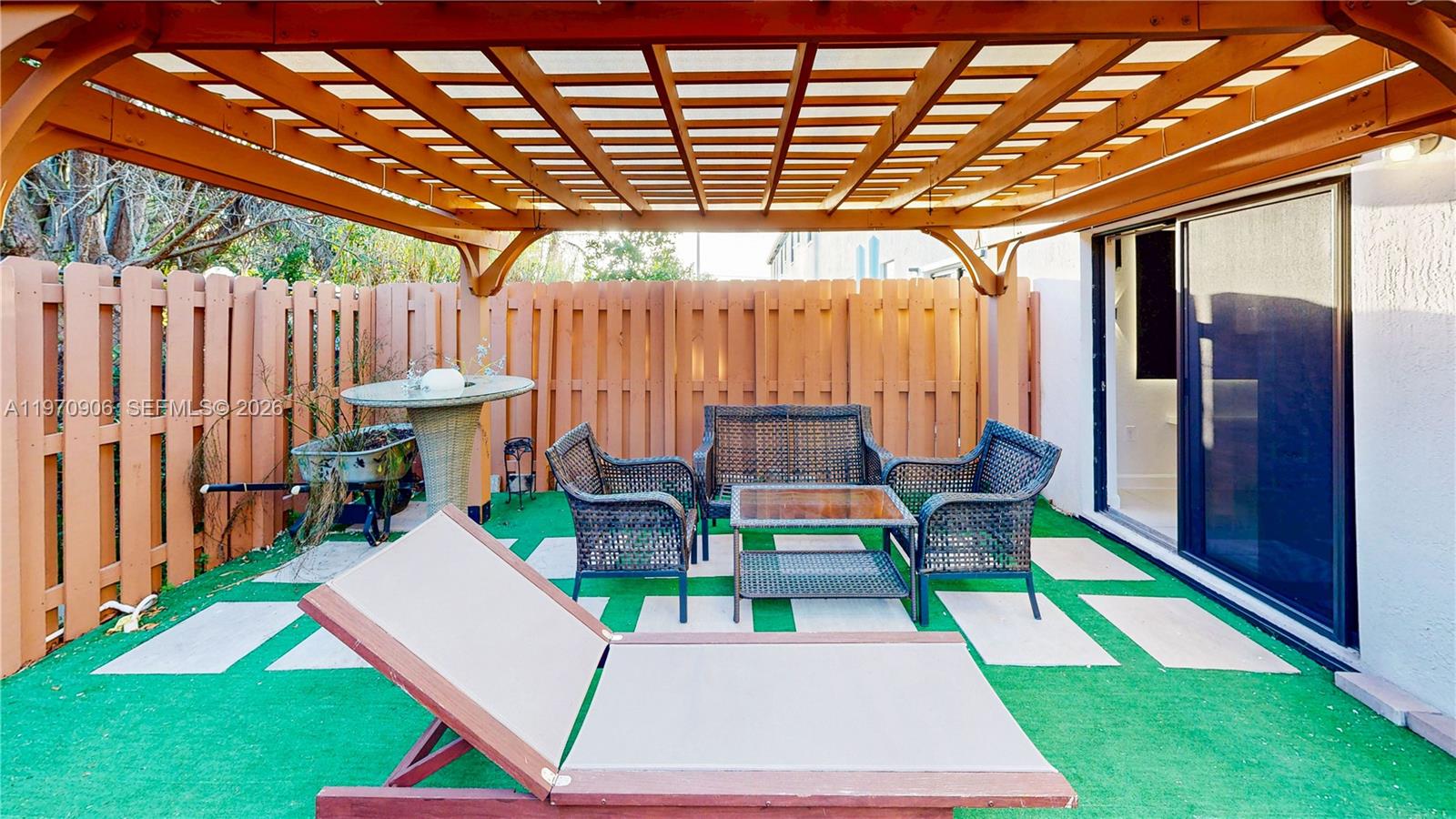 13158 Southwest 233rd Street Homestead, FL 33032 - Photo 45 of 72 a view of an chairs and tables in the patio