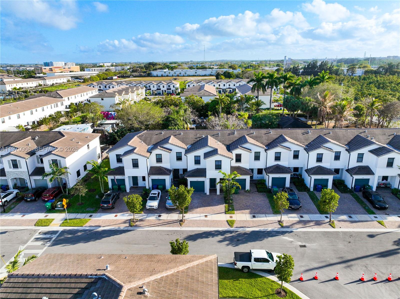 13158 Southwest 233rd Street Homestead, FL 33032 - Photo 59 of 72 an aerial view of residential houses with outdoor space and ocean view