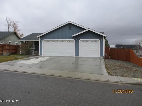 a view of front door and yard