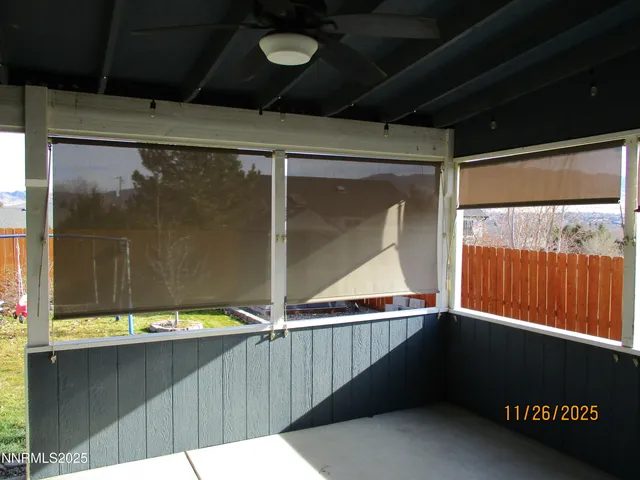 a kitchen with a dining table chairs refrigerator and cabinets