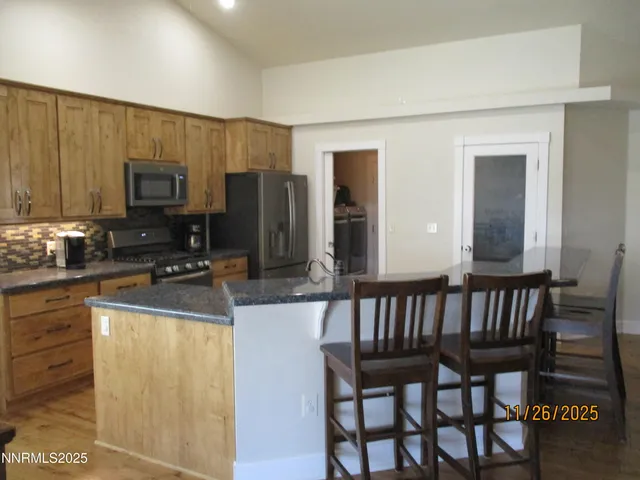 a room with storage and a shelf