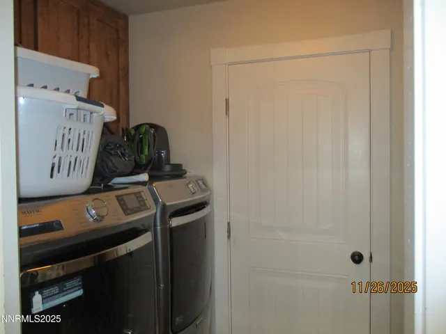a bedroom with bed and a chandelier