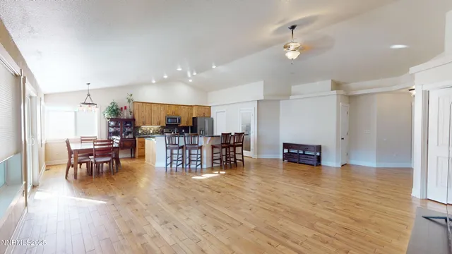 a view of a living room with furniture and a potted plant