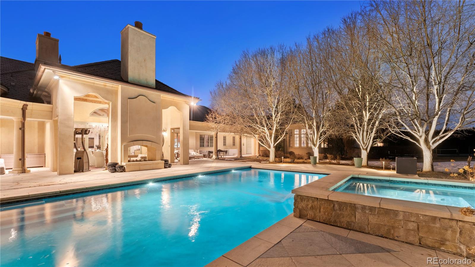 a swimming pool with outdoor seating and yard