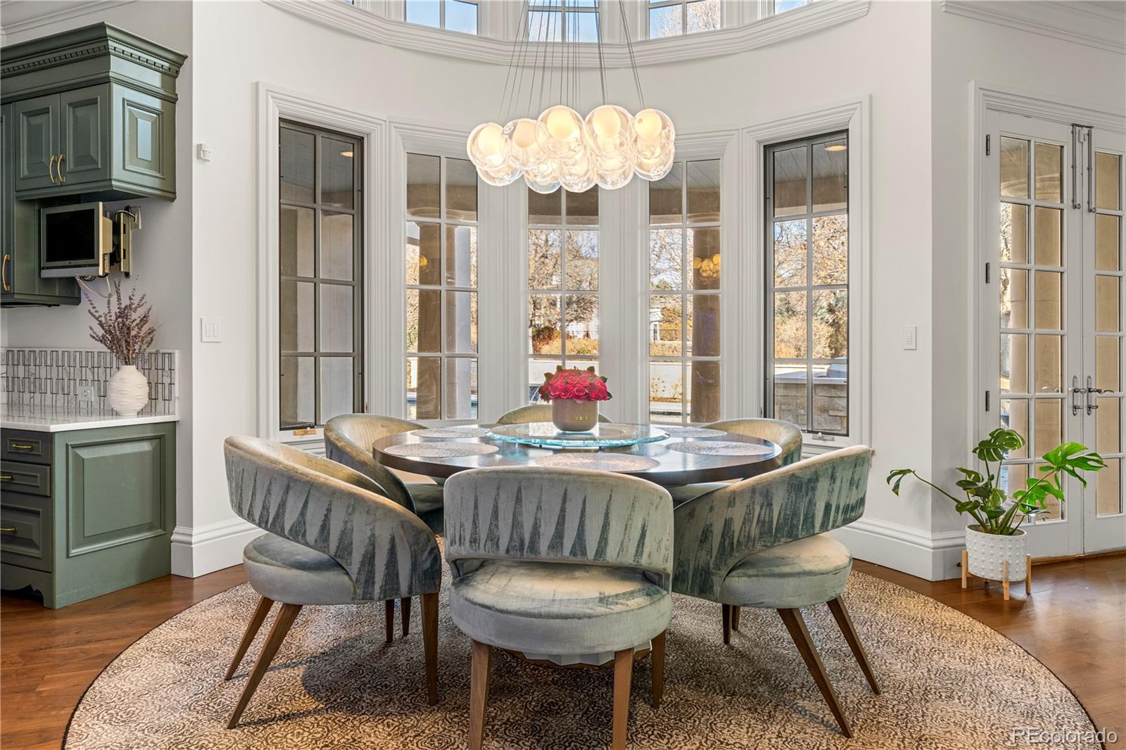 14 Sandy Lake Road Englewood, CO 80113 - Photo 11 of 13 a dining room with furniture a chandelier and wooden floor