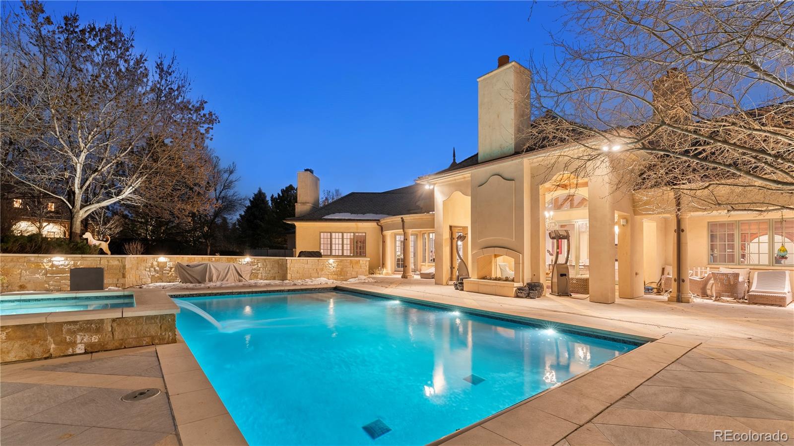 14 Sandy Lake Road Englewood, CO 80113 - Photo 2 of 13 a view of a swimming pool with a patio