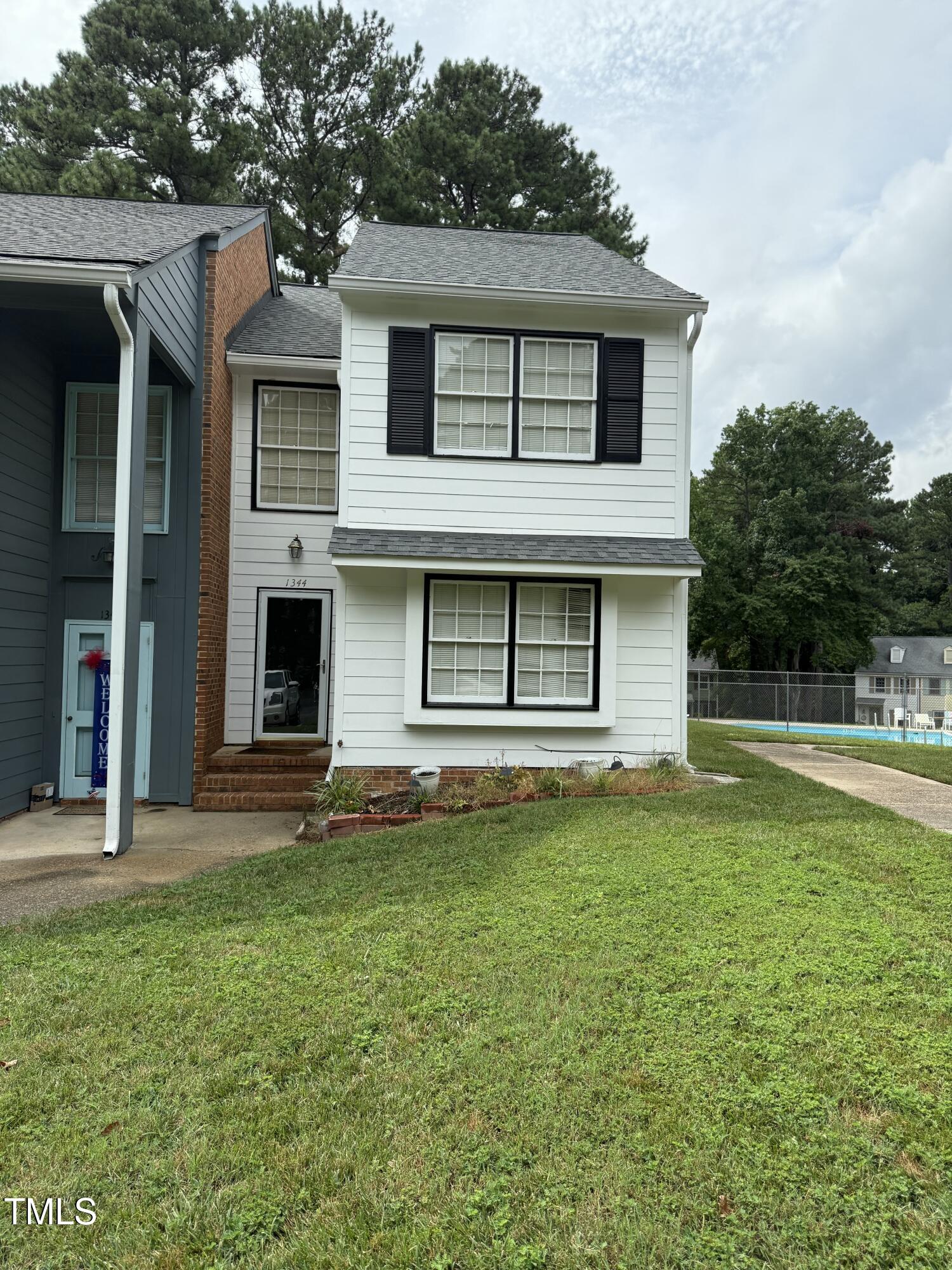 1344 Garden Crest Circle Raleigh, NC 27609 - Photo 1 of 6 a house that has a big yard in front of it