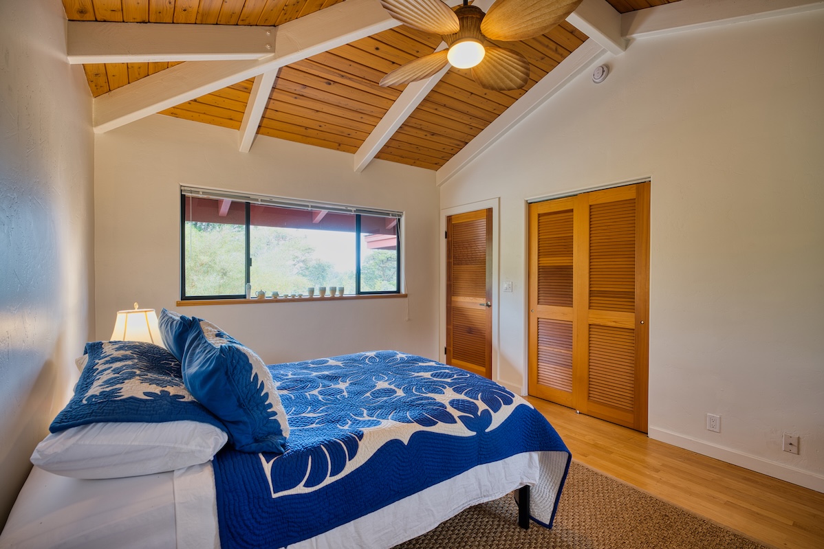 64-5221 Iokua Place Kamuela, HI 96743 - Photo 20 of 30 a bedroom with a bed and a window