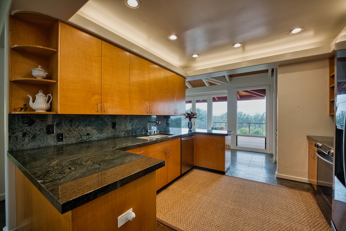 64-5221 Iokua Place Kamuela, HI 96743 - Photo 8 of 30 a kitchen with stainless steel appliances granite countertop a sink and a counter top space