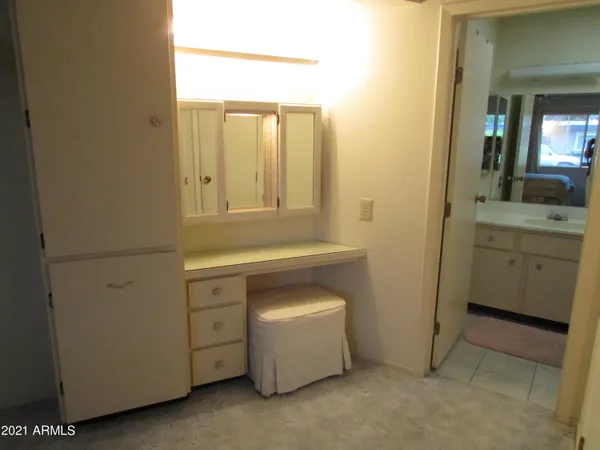 a room with a stove and a sink