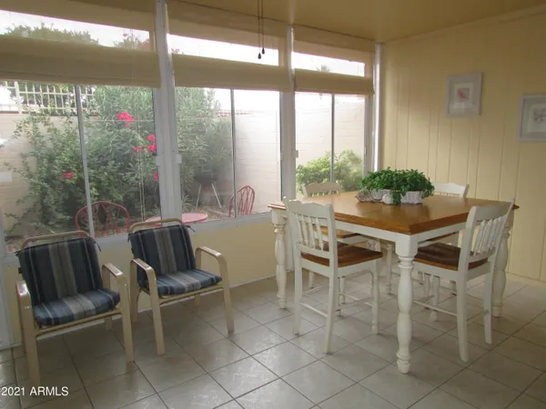 a view of a dining room with furniture window and outside view