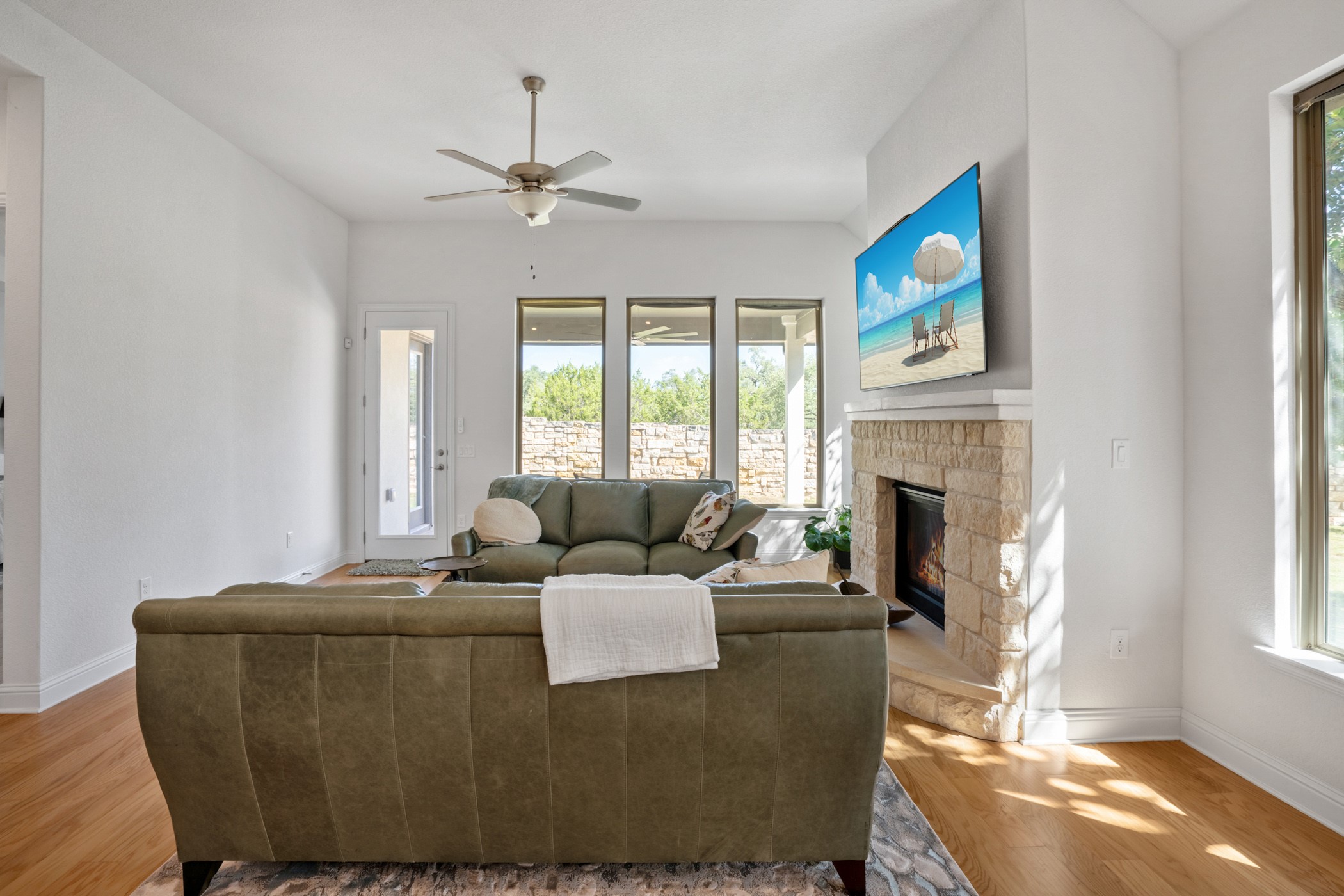 224 Diamondback Drive Georgetown, TX 78628 - Photo 14 of 39 a living room with furniture a large window and a fireplace