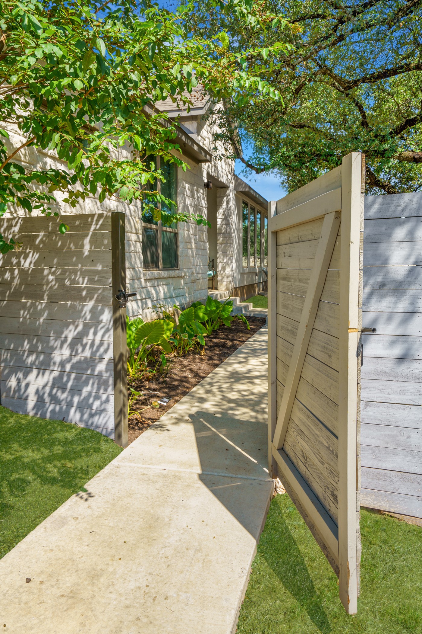224 Diamondback Drive Georgetown, TX 78628 - Photo 33 of 39 a view of a wooden door and a yard