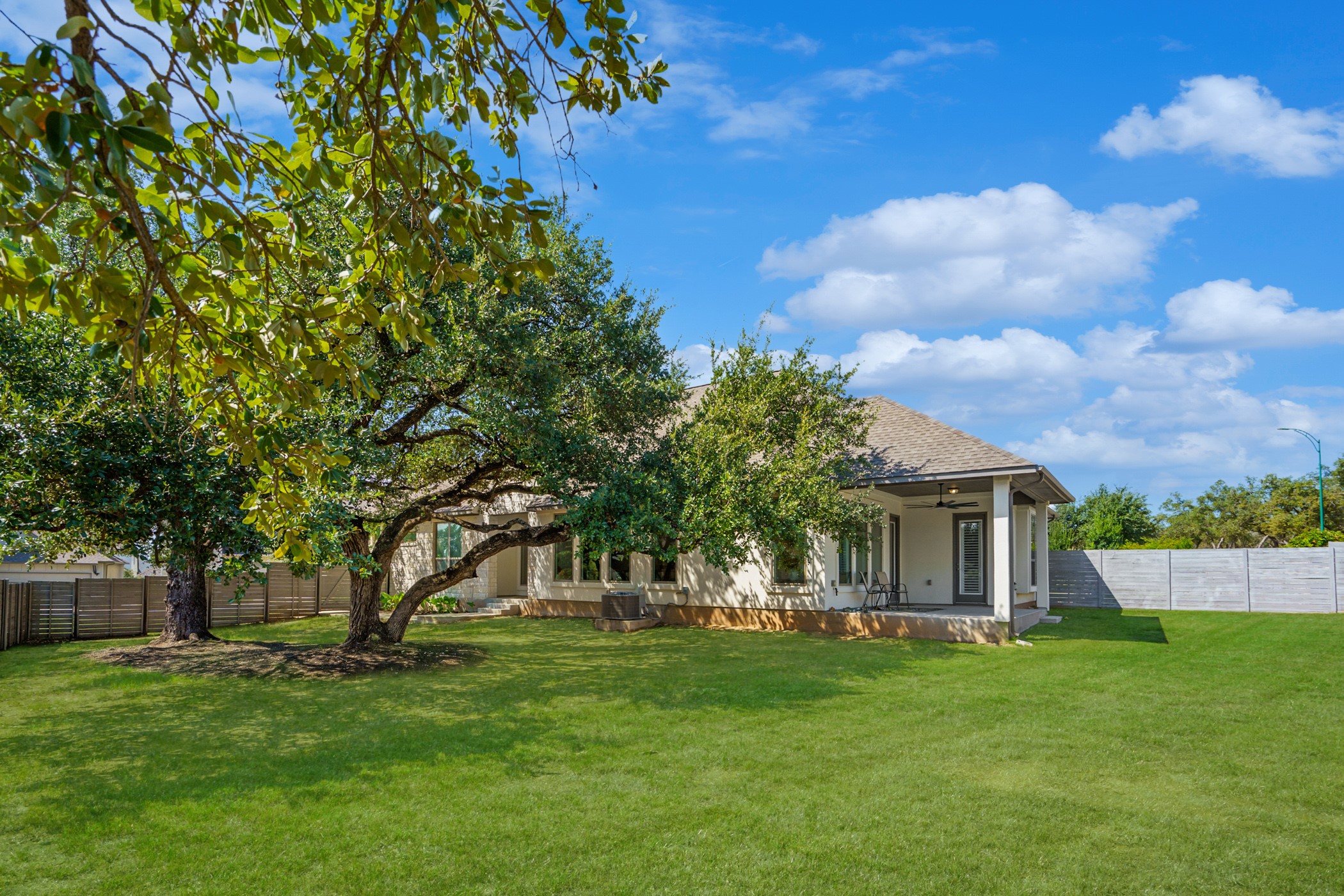 224 Diamondback Drive Georgetown, TX 78628 - Photo 36 of 39 a front view of a house with a garden