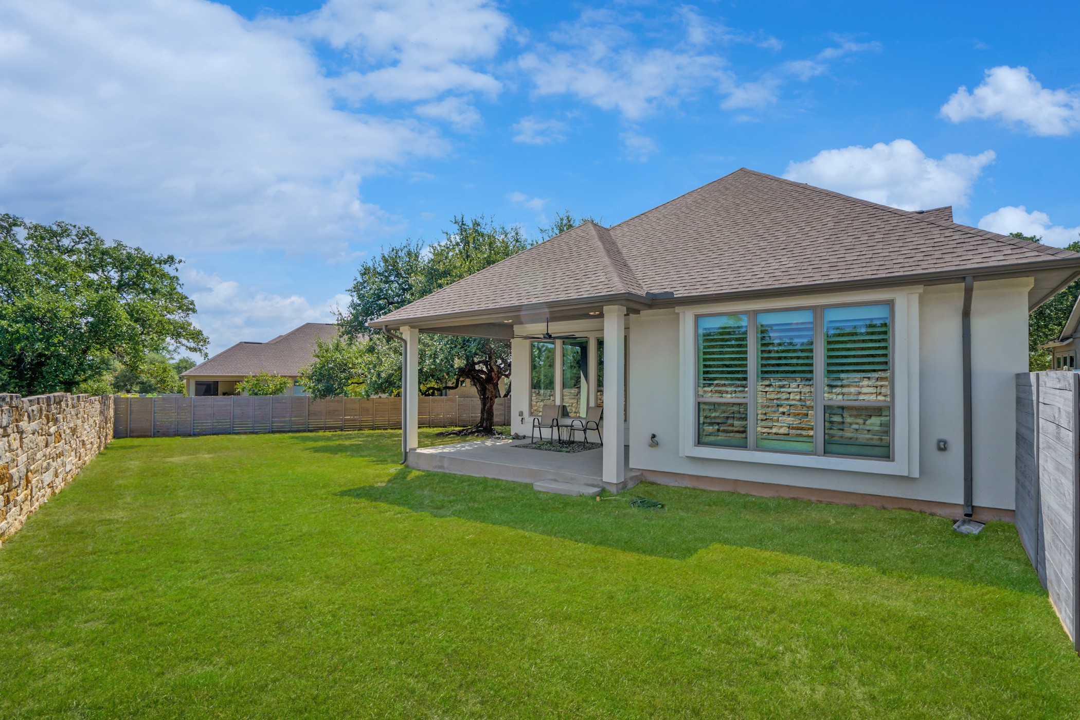 224 Diamondback Drive Georgetown, TX 78628 - Photo 39 of 39 a backyard of a house with table and chairs