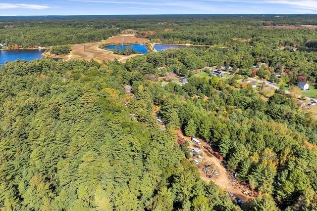 a view of a field with an ocean