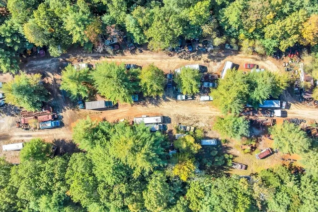 a backyard of a house with a yard with outdoor seating