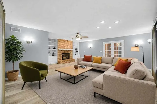 a living room with furniture and a fireplace