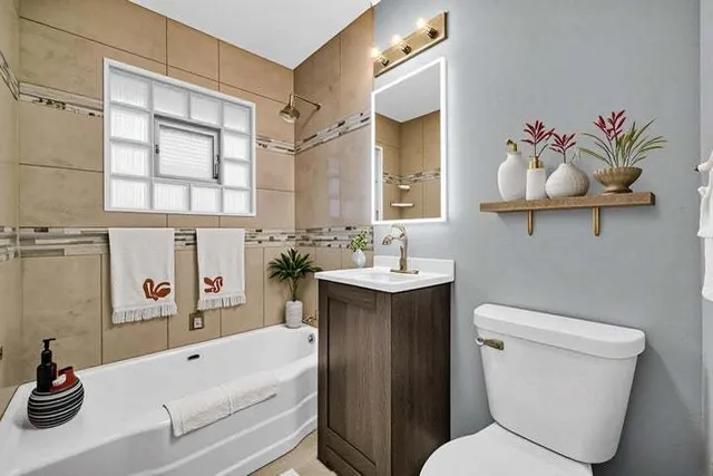 a bathroom with a sink a toilet and a bathtub