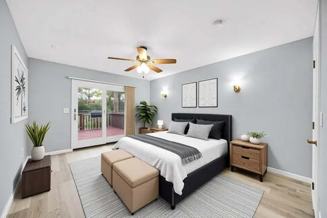 a bedroom with a large bed and a window