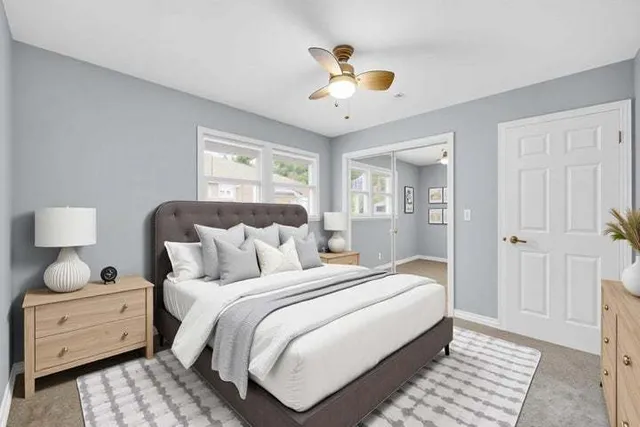 a bedroom with bed and a window