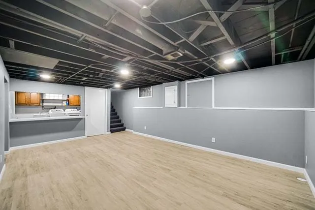 a view of empty room with wooden ceiling