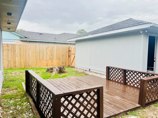 a view of a patio with table and chairs