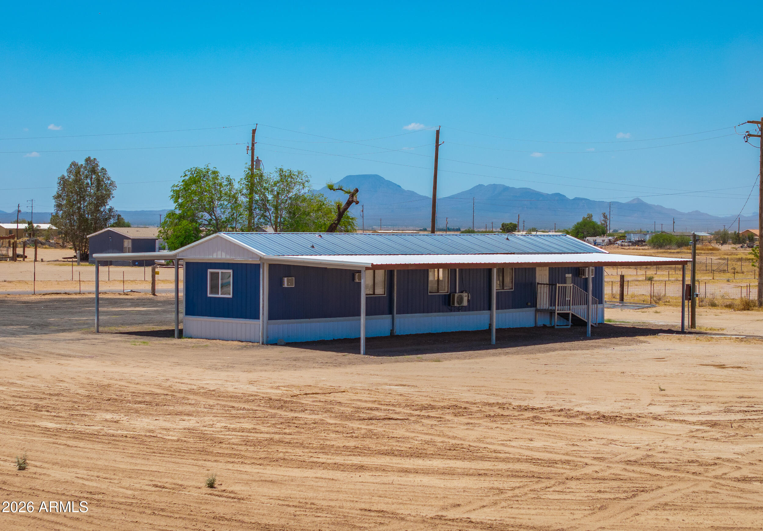 33776 West Siesta Road Stanfield, AZ 85172 - Photo 16 of 54 a view of a house with a backyard
