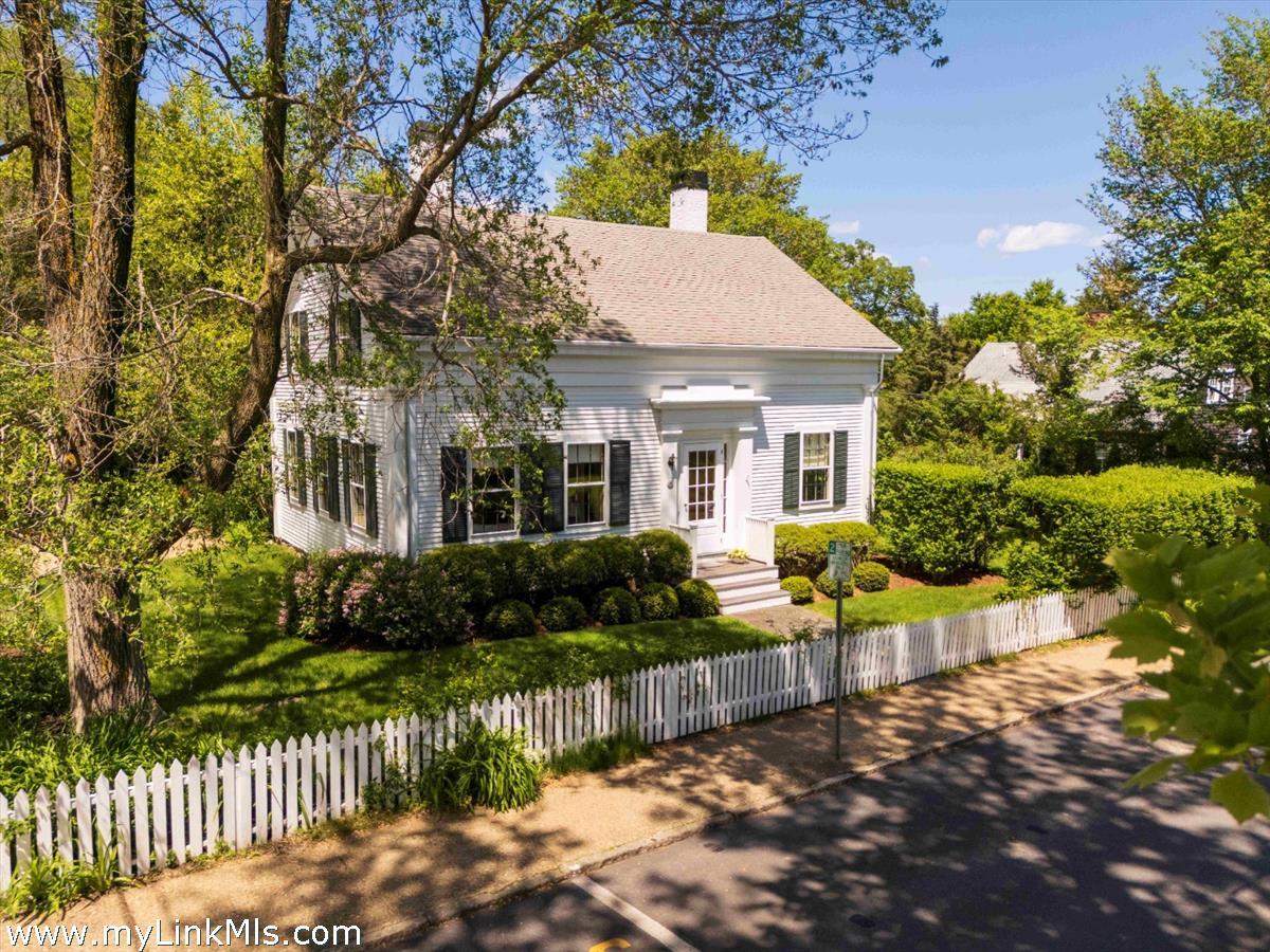 27 Spring Street Vineyard Haven, MA 02568 - Photo 1 of 58 a front view of a house with a yard