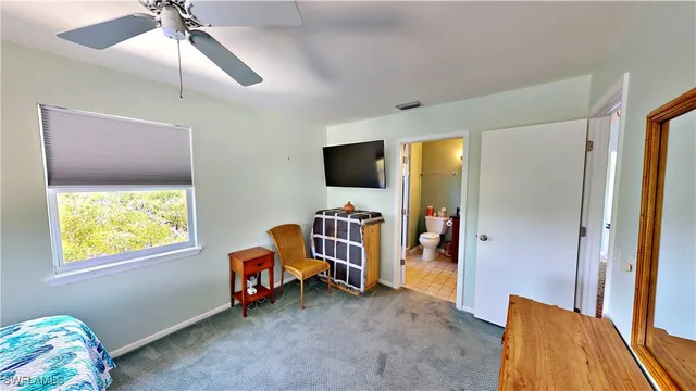 a room with furniture and a flat screen tv