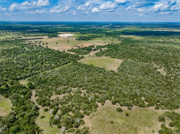 a view of a field with an outdoor space