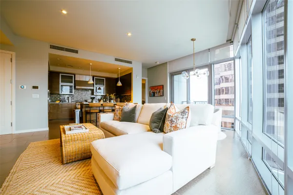 a living room with furniture and a large window