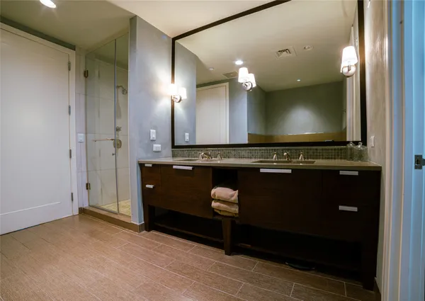 a bathroom with a sink a vanity and a mirror