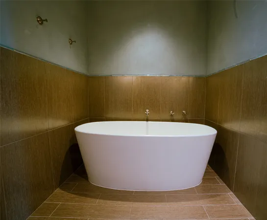 a white bath tub sitting in a bathroom