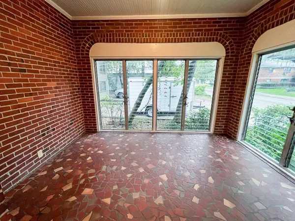 a view of a room with large windows