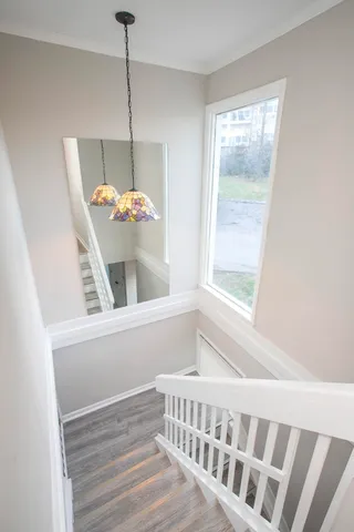 a bathroom with a window and tub