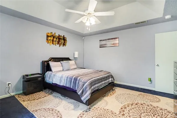 a bedroom with bed and a window