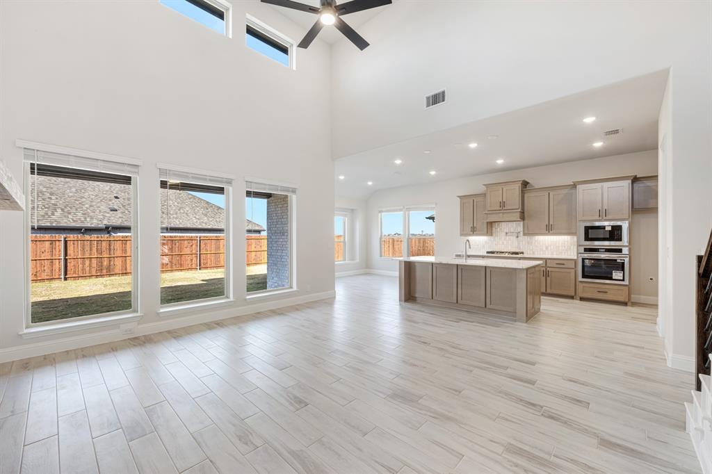 2411 Cornwall Lane Forney, TX 75126 - Photo 11 of 40 a view of kitchen with cabinets and wooden floor