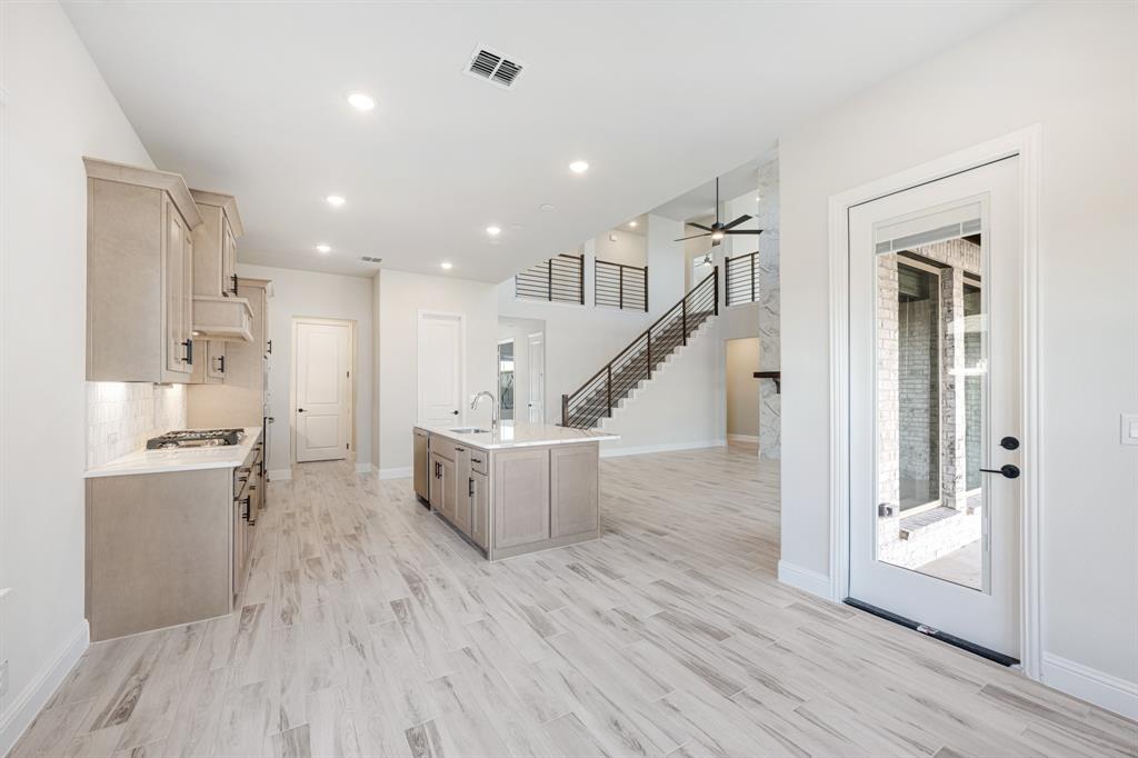2411 Cornwall Lane Forney, TX 75126 - Photo 16 of 40 a view of kitchen with sink and refrigerator