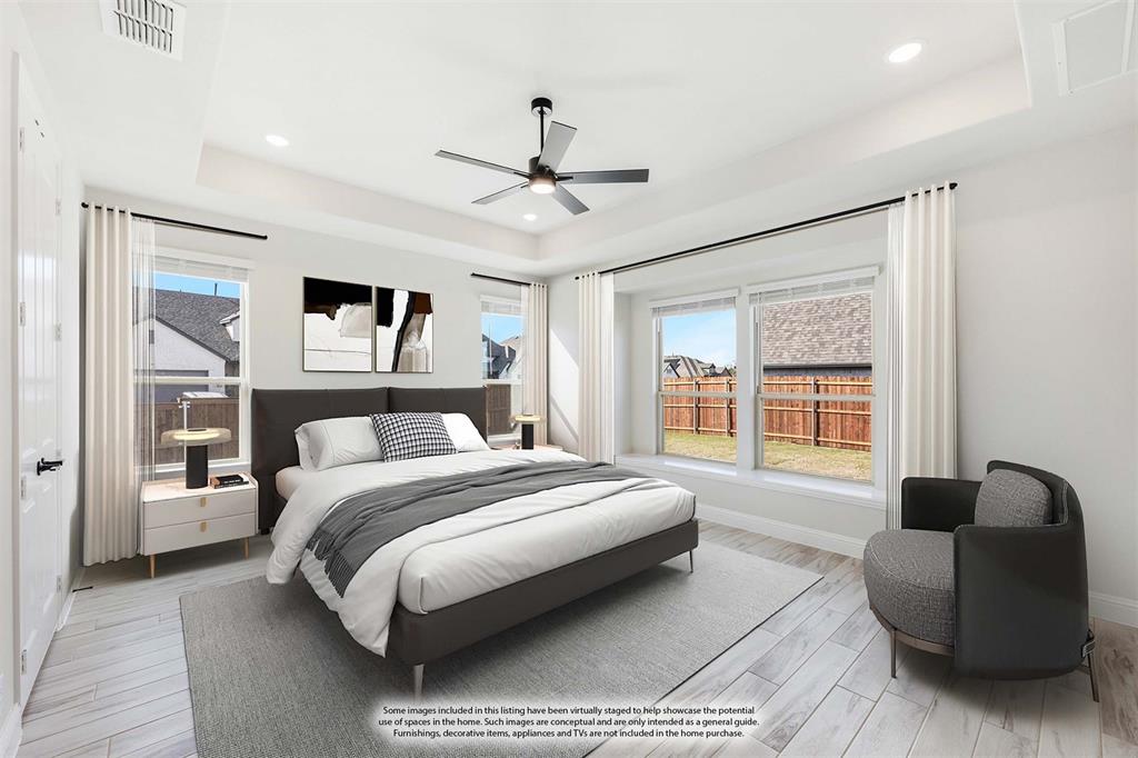 2411 Cornwall Lane Forney, TX 75126 - Photo 18 of 40 a spacious bedroom with a bed couch and a window