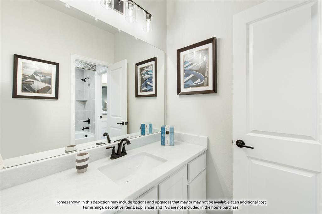 2411 Cornwall Lane Forney, TX 75126 - Photo 31 of 34 a bathroom with a sink a window and a mirror