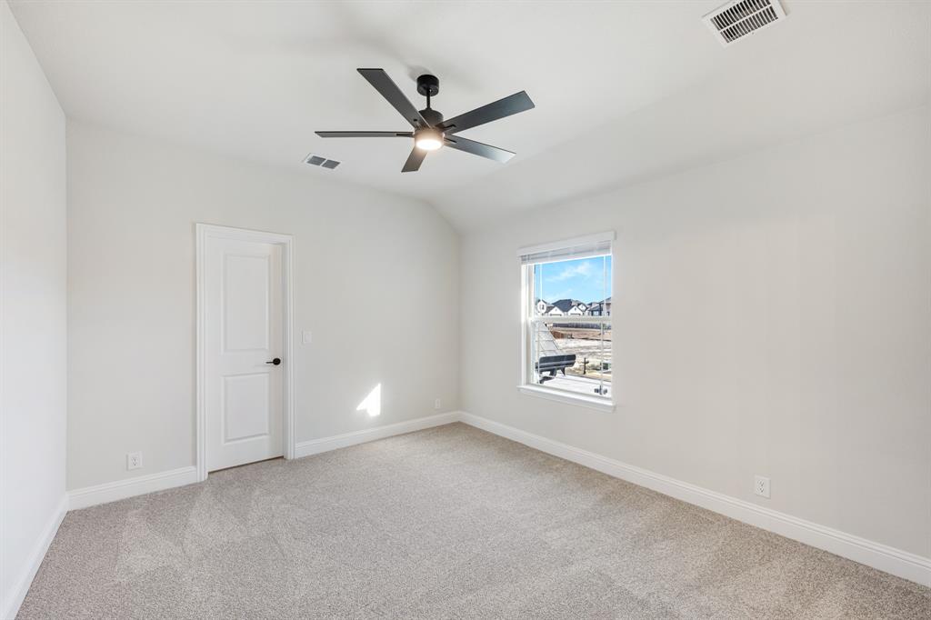 2411 Cornwall Lane Forney, TX 75126 - Photo 35 of 40 a view of an empty room with a window