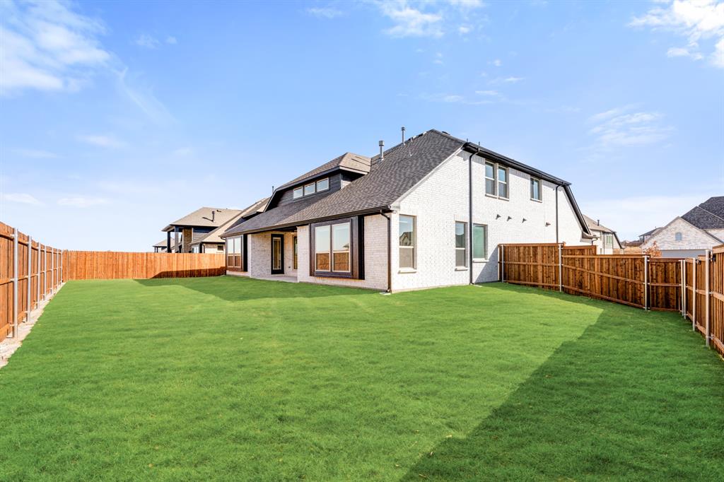 2411 Cornwall Lane Forney, TX 75126 - Photo 38 of 40 a view of a house with backyard and garden