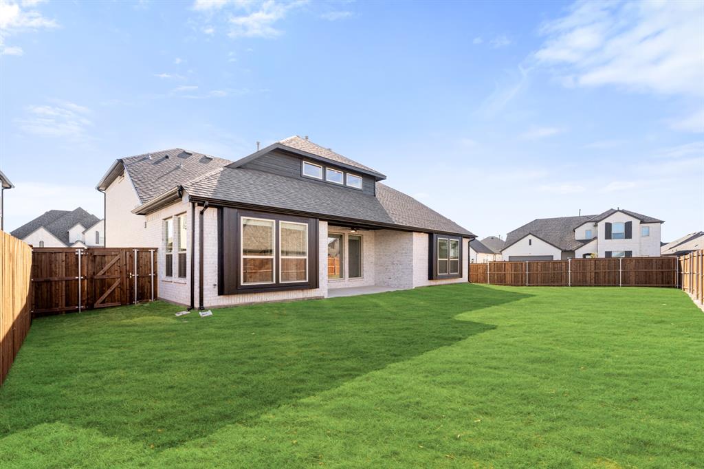 2411 Cornwall Lane Forney, TX 75126 - Photo 39 of 40 a view of a yard in front of a house with large trees