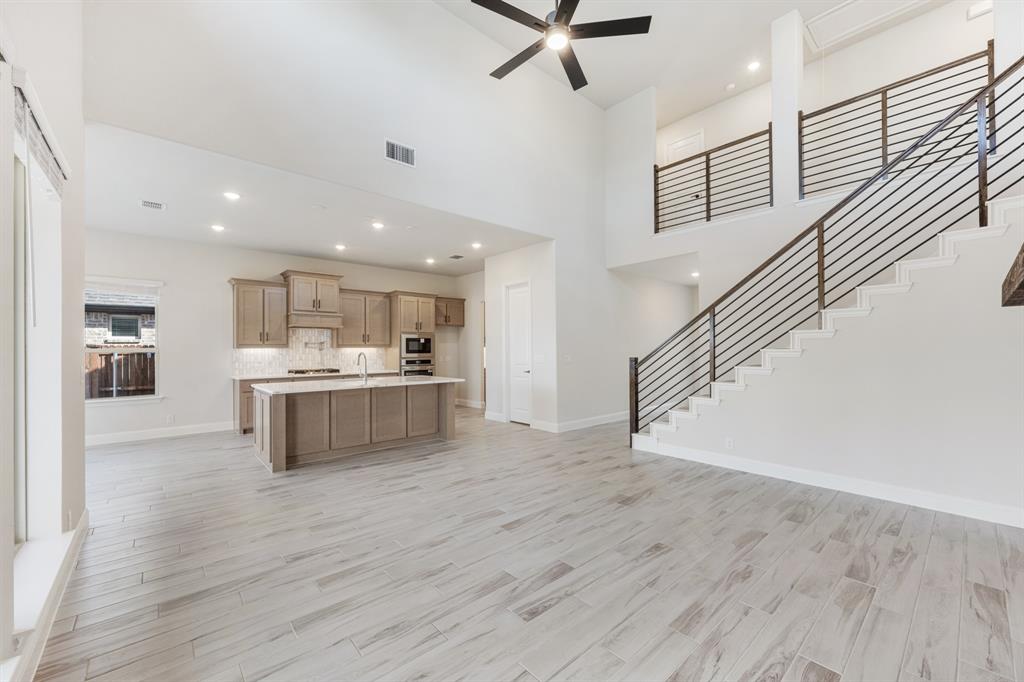 2411 Cornwall Lane Forney, TX 75126 - Photo 8 of 40 a view of kitchen with wooden floor and electronic appliances