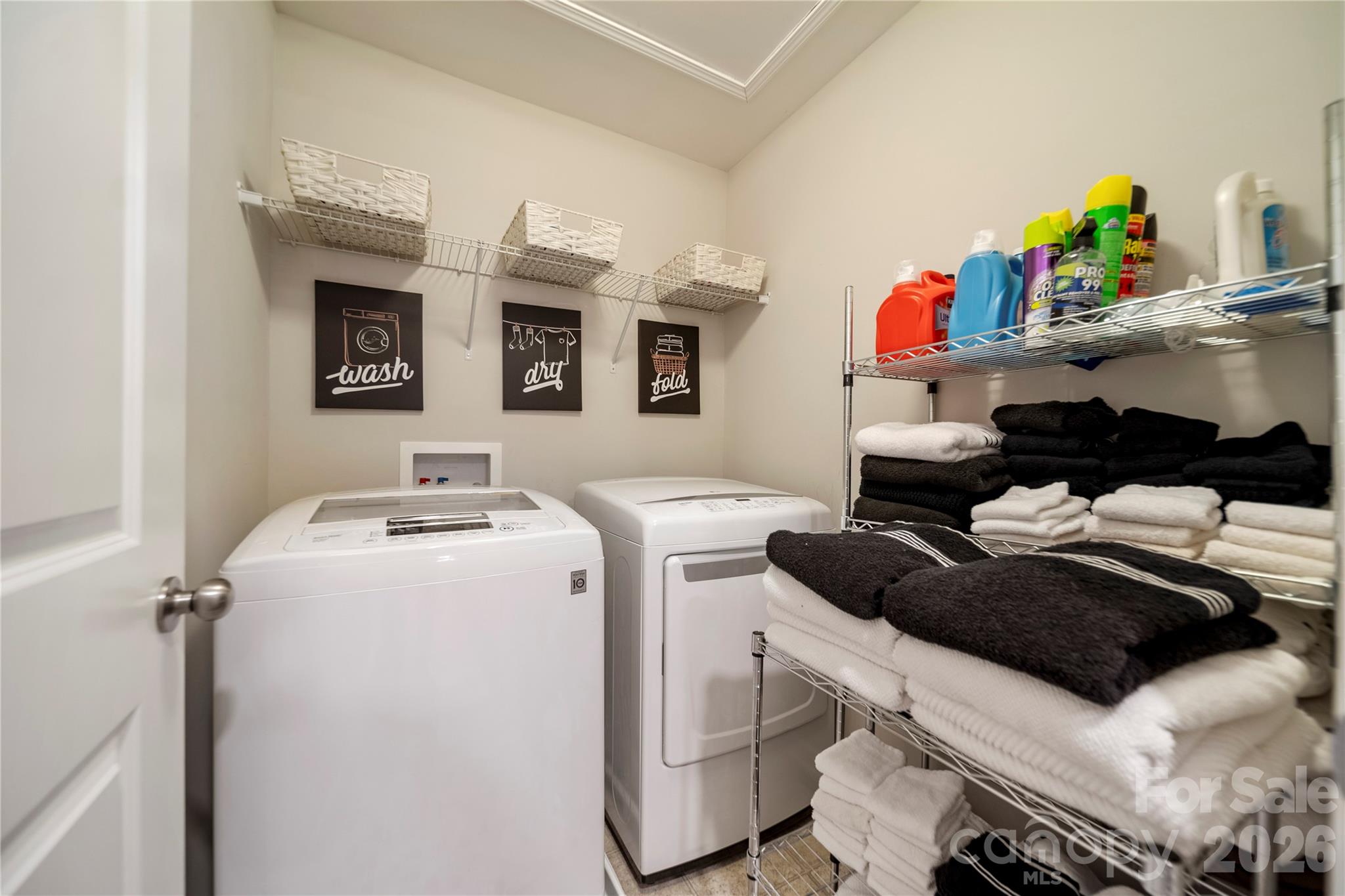 8122 Mossy Rock Road Waxhaw, NC 28173 - Photo 25 of 28 a utility room with dryer and washer