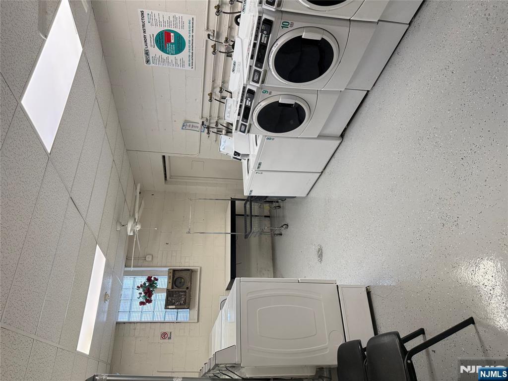 77 Prospect Avenue, Unit 1A Hackensack, NJ 07601 - Photo 10 of 10 a utility room with washer and dryer
