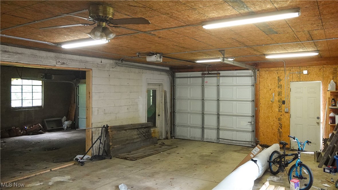4088 Manchester Road Akron, OH 44319 - Photo 39 of 50 Garage with a garage door opener and ceiling fan