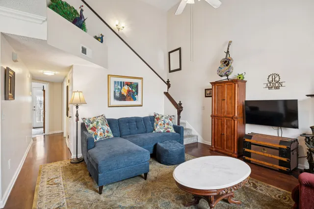 a living room with furniture and a flat screen tv
